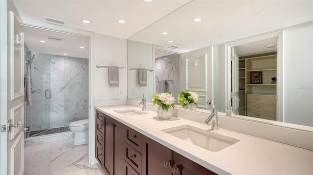 99 Sunset Dr Unit 102, Sarasota, FL 34236 - bathroom with a marble finish shower, marble look tile flooring, recessed lighting, toilet, and double vanity