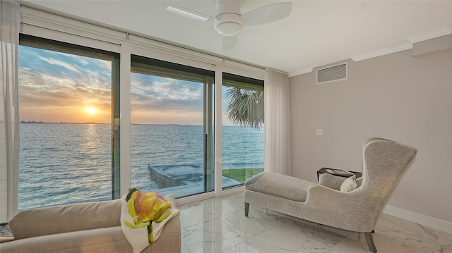 99 Sunset Dr Unit 102, Sarasota, FL 34236 - sitting room with a water view, healthy amount of natural light, ornamental molding, and marble finish flooring