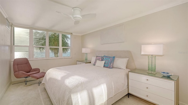 99 Sunset Dr Unit 102, Sarasota, FL 34236 - bedroom featuring light colored carpet, crown molding, baseboards, and ceiling fan