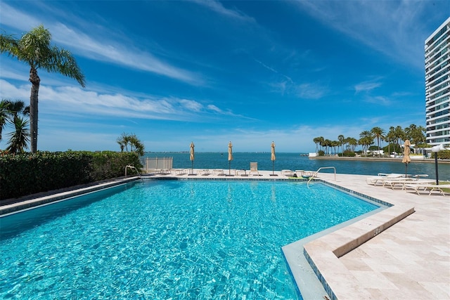 99 Sunset Dr Unit 102, Sarasota, FL 34236 - community pool featuring a water view and a patio area