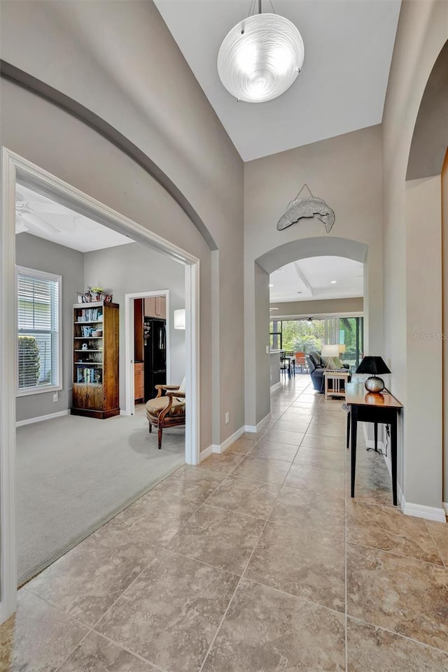 5009 Lake Overlook Ave, Bradenton, FL 34208 - hallway with arched walkways and baseboards