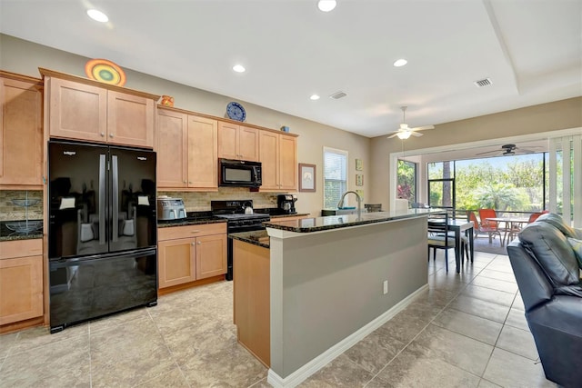 5009 Lake Overlook Ave, Bradenton, FL 34208 - kitchen with decorative backsplash, black appliances, ceiling fan, and light brown cabinetry