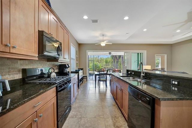 5009 Lake Overlook Ave, Bradenton, FL 34208 - kitchen with backsplash, black appliances, visible vents, ceiling fan, and a sink