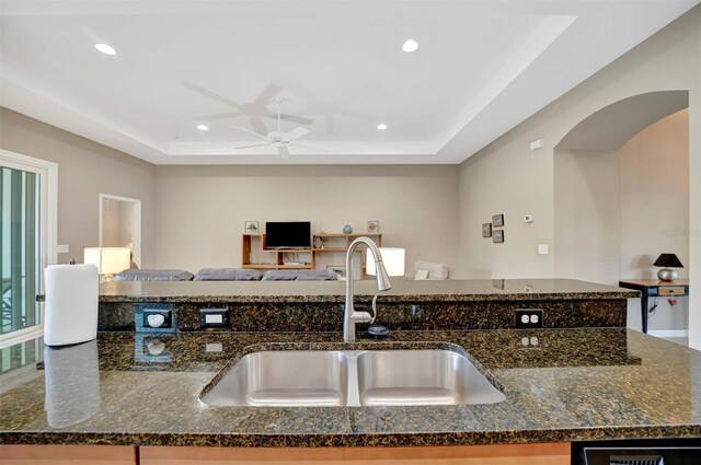 5009 Lake Overlook Ave, Bradenton, FL 34208 - kitchen with a sink, a raised ceiling, dark stone countertops, and recessed lighting