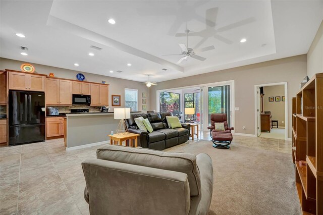 5009 Lake Overlook Ave, Bradenton, FL 34208 - living room with recessed lighting, visible vents, ceiling fan, and a raised ceiling