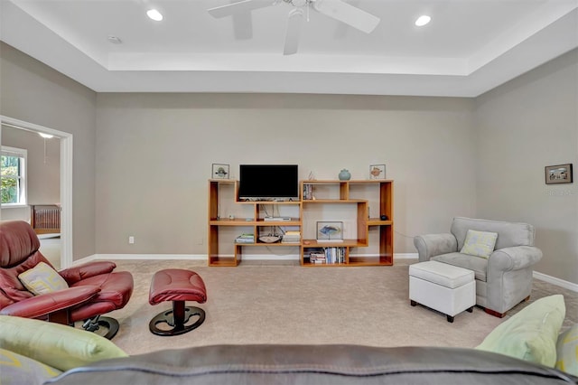 5009 Lake Overlook Ave, Bradenton, FL 34208 - carpeted living room with a tray ceiling, ceiling fan, baseboards, and recessed lighting