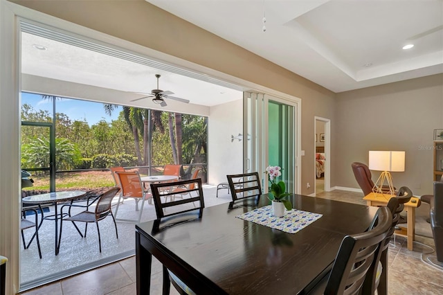 5009 Lake Overlook Ave, Bradenton, FL 34208 - tiled dining area with a ceiling fan and a healthy amount of sunlight