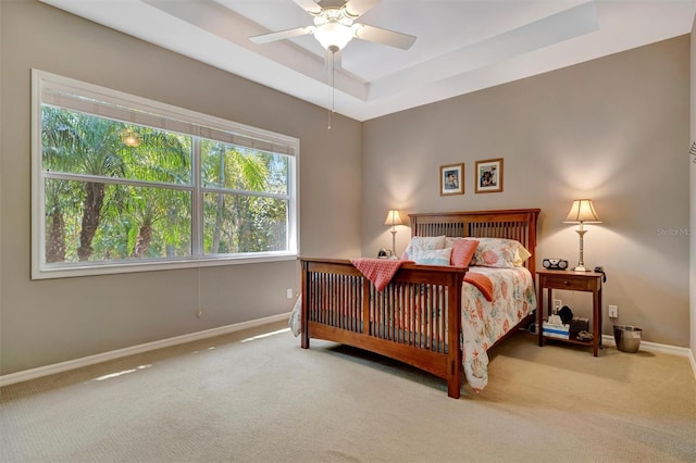 5009 Lake Overlook Ave, Bradenton, FL 34208 - carpeted bedroom with baseboards, a raised ceiling, and ceiling fan