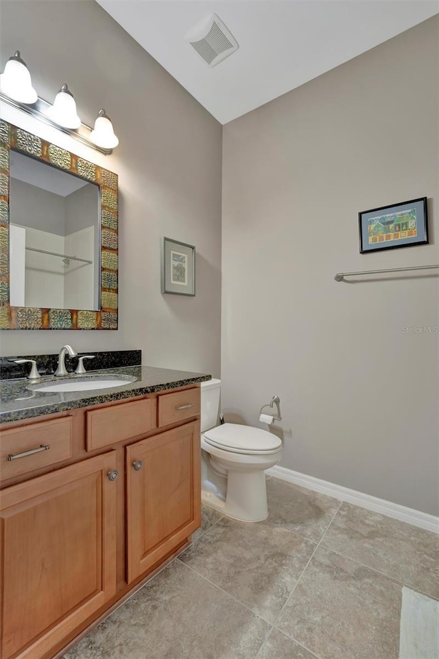 5009 Lake Overlook Ave, Bradenton, FL 34208 - bathroom with vanity, visible vents, toilet, tile patterned floors, and baseboards