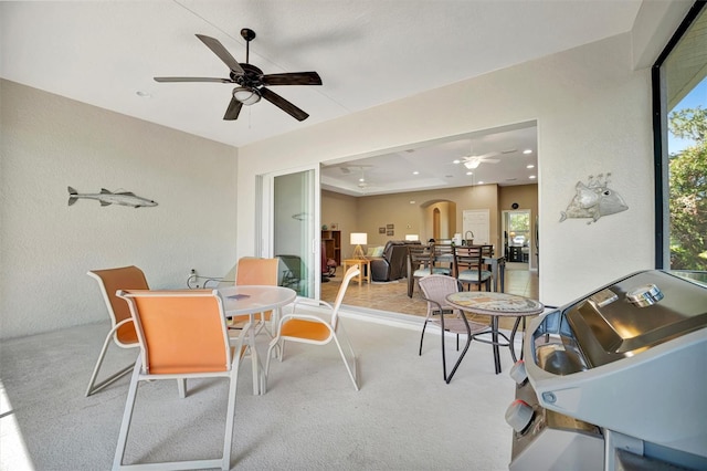 5009 Lake Overlook Ave, Bradenton, FL 34208 - dining room featuring ceiling fan, recessed lighting, arched walkways, and carpet