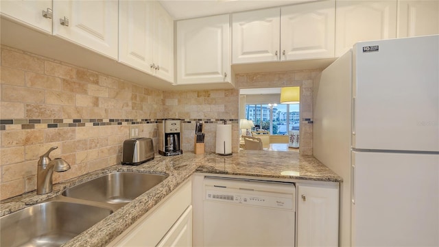 4350 Chatham Dr Unit E-105, Longboat Key, FL 34228 - kitchen featuring white appliances, a sink, decorative backsplash, and white cabinets