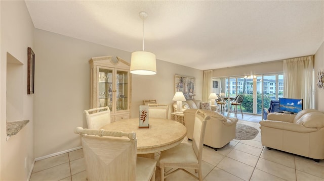 4350 Chatham Dr Unit E-105, Longboat Key, FL 34228 - dining room with light tile patterned floors