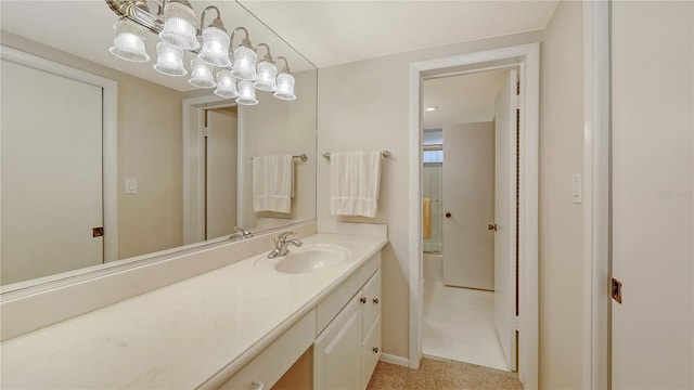 4350 Chatham Dr Unit E-105, Longboat Key, FL 34228 - bathroom with vanity and baseboards
