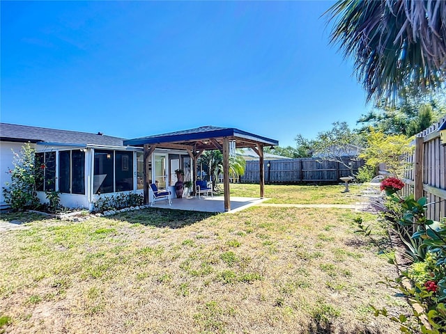 2705 21st Ave W, Bradenton, FL 34205 - view of yard featuring a patio area, a fenced backyard, a sunroom, and a gazebo