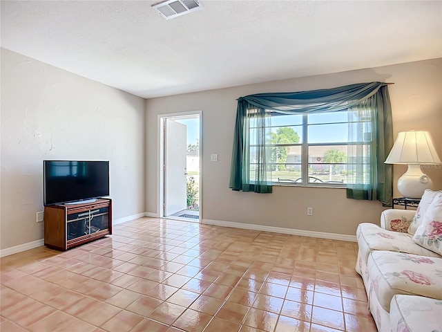 2705 21st Ave W, Bradenton, FL 34205 - living area with baseboards, visible vents, and light tile patterned floors