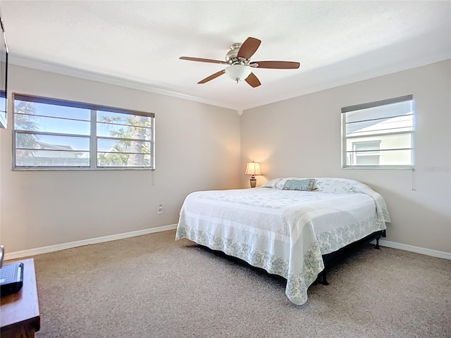 2705 21st Ave W, Bradenton, FL 34205 - carpeted bedroom featuring crown molding, baseboards, and ceiling fan