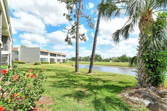 7173 W Country Club Dr N Unit 141, Sarasota, FL 34243 - exterior space with a water view and a lawn