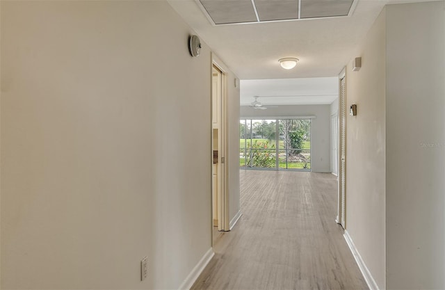 7173 W Country Club Dr N Unit 141, Sarasota, FL 34243 - hallway with light wood-type flooring, baseboards, and visible vents