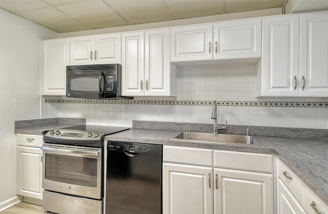 7173 W Country Club Dr N Unit 141, Sarasota, FL 34243 - kitchen featuring a sink, tasteful backsplash, white cabinets, and black appliances
