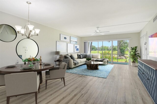 7173 W Country Club Dr N Unit 141, Sarasota, FL 34243 - living area featuring light wood-type flooring, ceiling fan with notable chandelier, and visible vents
