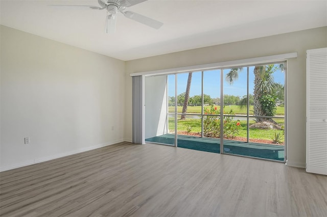7173 W Country Club Dr N Unit 141, Sarasota, FL 34243 - spare room with wood finished floors, baseboards, and a ceiling fan