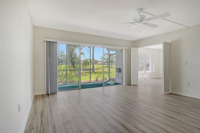 7173 W Country Club Dr N Unit 141, Sarasota, FL 34243 - unfurnished room with baseboards, ceiling fan, and wood finished floors