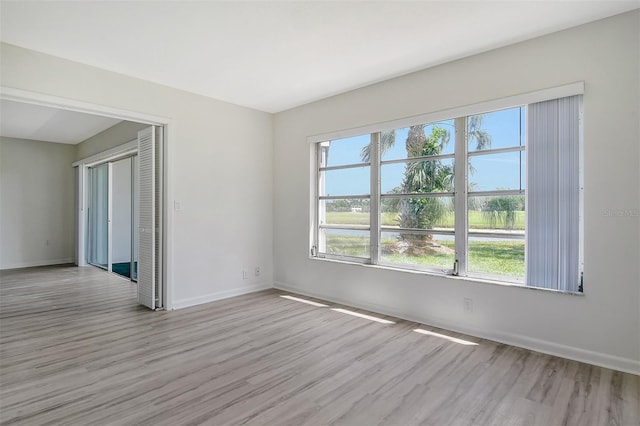 7173 W Country Club Dr N Unit 141, Sarasota, FL 34243 - empty room featuring baseboards and wood finished floors