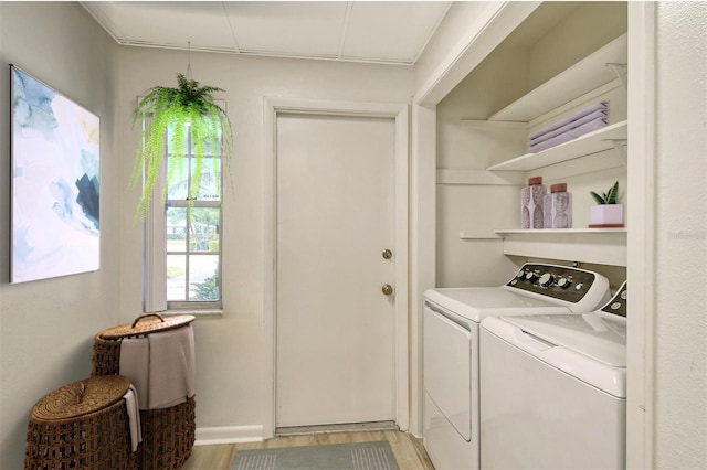 7173 W Country Club Dr N Unit 141, Sarasota, FL 34243 - laundry area with light wood-style flooring, washer and clothes dryer, and laundry area