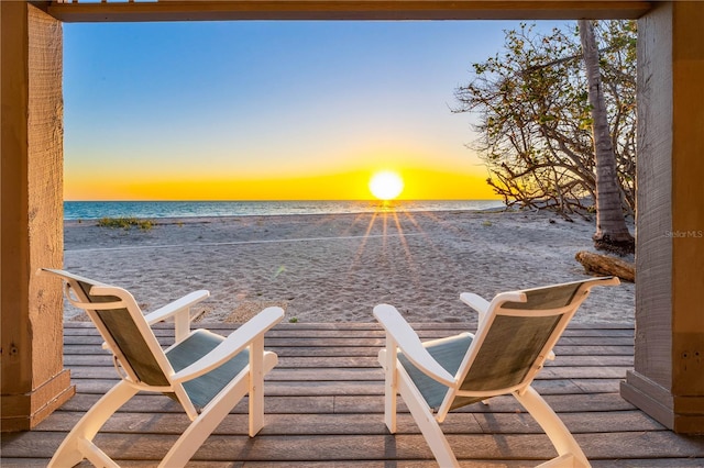 8592 Hidden Lagoon Rd, Sarasota, FL 34242 - patio terrace at dusk with view of water and beach