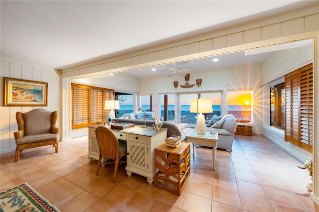 8592 Hidden Lagoon Rd, Sarasota, FL 34242 - living area with light tile patterned floors and ceiling fan
