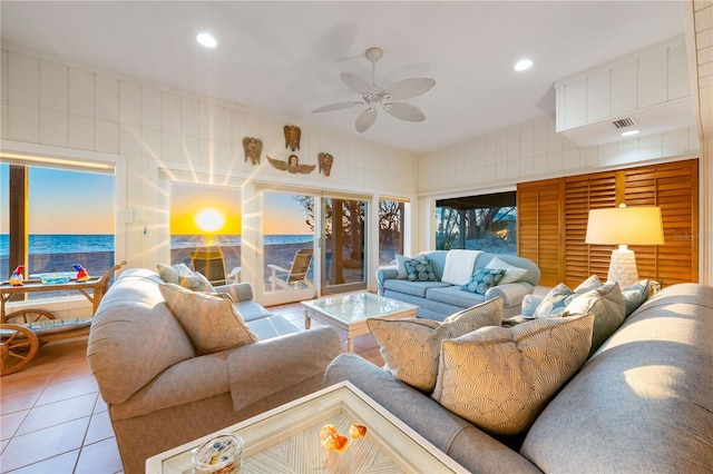 8592 Hidden Lagoon Rd, Sarasota, FL 34242 - living room featuring tile patterned flooring, ceiling fan, a water view, recessed lighting, and plenty of natural light