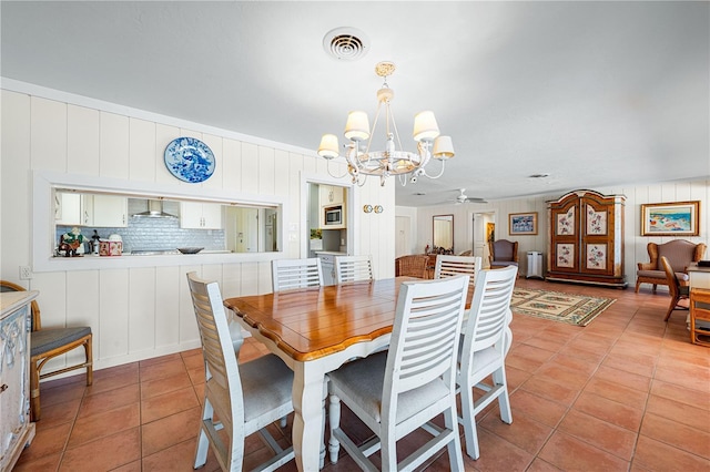 8592 Hidden Lagoon Rd, Sarasota, FL 34242 - dining room with a chandelier, a ceiling fan, and light tile patterned flooring