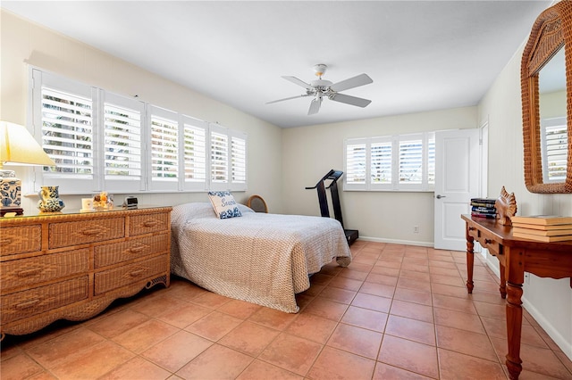 8592 Hidden Lagoon Rd, Sarasota, FL 34242 - bedroom featuring light tile patterned floors and a ceiling fan