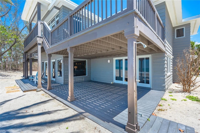8592 Hidden Lagoon Rd, Sarasota, FL 34242 - wooden terrace featuring a patio and french doors