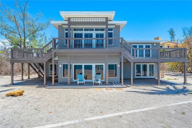 8592 Hidden Lagoon Rd, Sarasota, FL 34242 - rear view of house with a deck and stairs