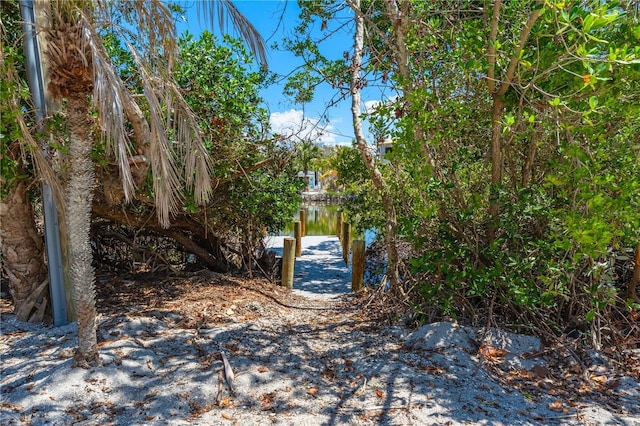 8592 Hidden Lagoon Rd, Sarasota, FL 34242 - view of yard with a boat dock