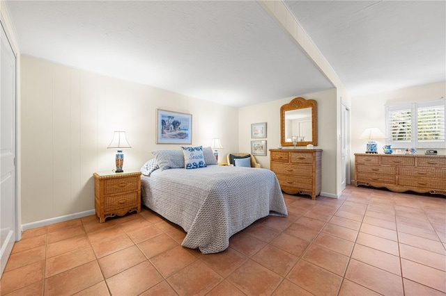 8592 Hidden Lagoon Rd, Sarasota, FL 34242 - bedroom with light tile patterned floors