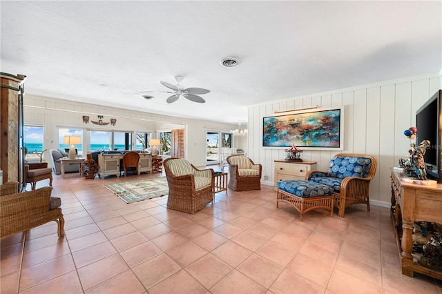 8592 Hidden Lagoon Rd, Sarasota, FL 34242 - living room featuring a ceiling fan and light tile patterned flooring