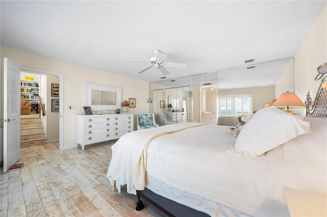 8592 Hidden Lagoon Rd, Sarasota, FL 34242 - bedroom with light wood-style flooring and a ceiling fan