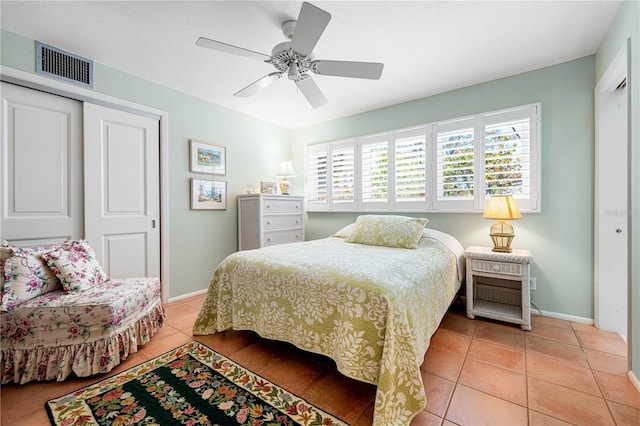8592 Hidden Lagoon Rd, Sarasota, FL 34242 - bedroom with light tile patterned floors, a closet, and a ceiling fan