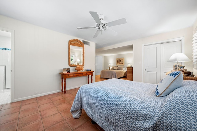 8592 Hidden Lagoon Rd, Sarasota, FL 34242 - bedroom featuring tile patterned flooring, a closet, and a ceiling fan
