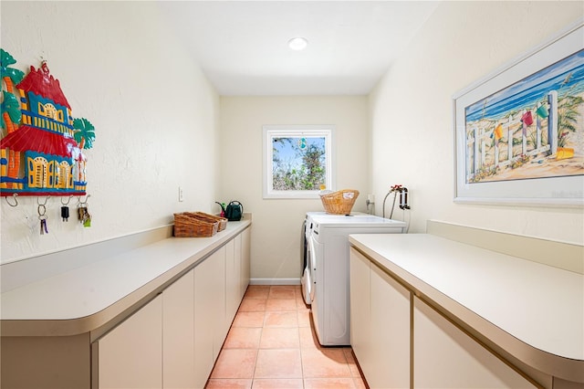 8592 Hidden Lagoon Rd, Sarasota, FL 34242 - laundry room with washing machine and clothes dryer, cabinet space, light tile patterned flooring, and recessed lighting