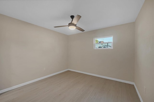 unfurnished room with light wood-style floors, baseboards, and ceiling fan