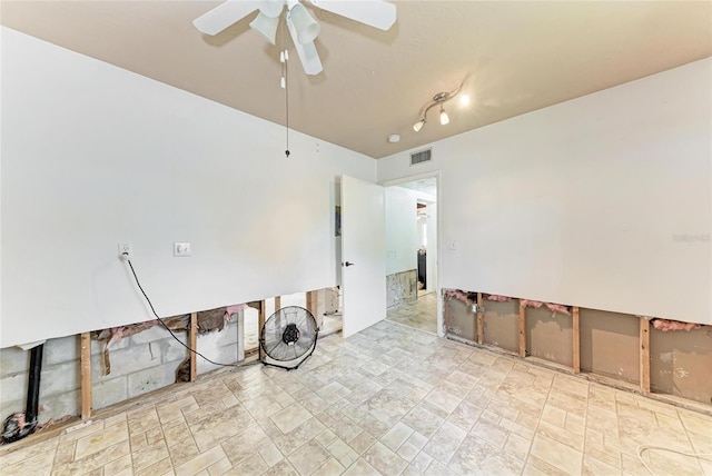 spare room with visible vents and a ceiling fan