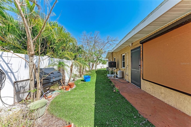 view of yard with a fenced backyard