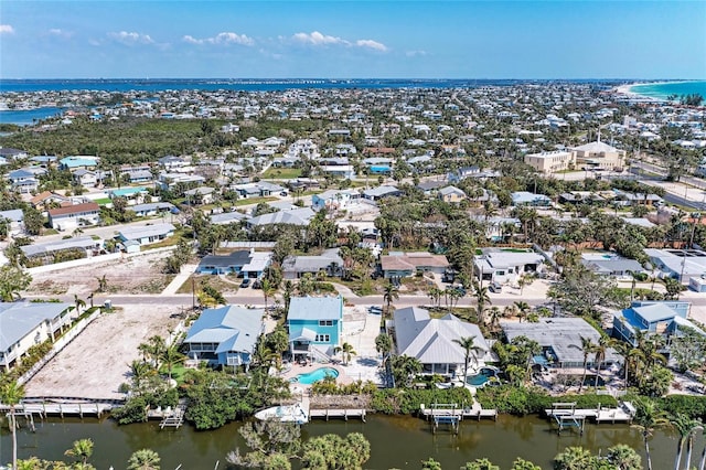 aerial view with a water view and a residential view