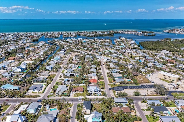 birds eye view of property with a residential view and a water view