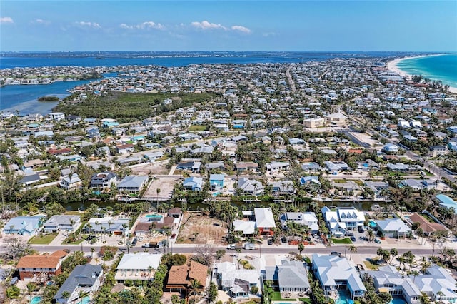 drone / aerial view featuring a water view and a residential view