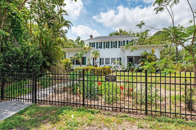 2326 2nd Ave E, Bradenton, FL 34208 - view of front of home with a chimney and a gate