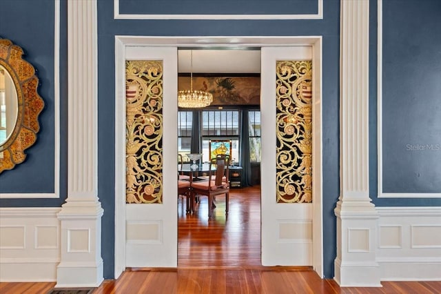 2326 2nd Ave E, Bradenton, FL 34208 - entrance foyer featuring ornate columns, wood finished floors, and a chandelier
